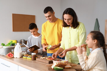 Happy family cooking in kitchen