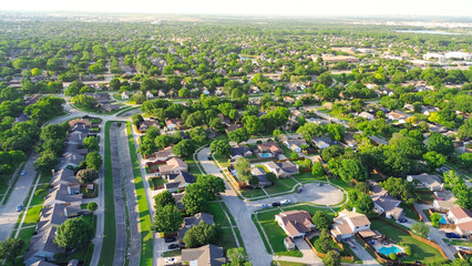 Suburban neighborhood with concrete channels facilitates drainage discharge into creek, cul-de-sac...