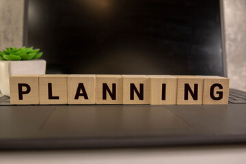 Estate Planning text concept written on wooden blocks lying on a table