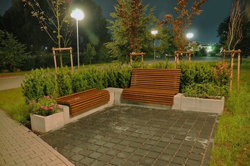 A part of a separate place in the city for resting benches in the background of the garden - night view