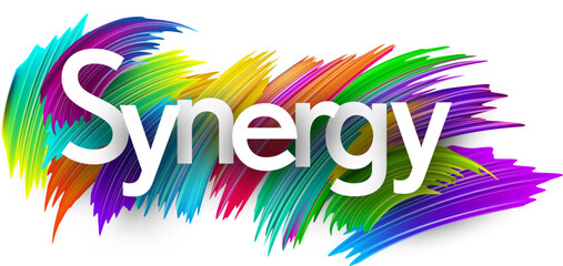 Synergy paper word sign with colorful spectrum paint brush strokes over white.