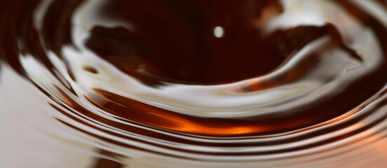 Macro shot of tea drink ripples as background