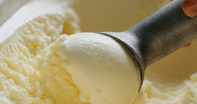 4K footage Close-up Front view, Scoop out vanilla-flavored ice cream.