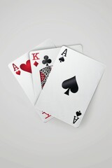 Obraz premium Four playing cards displayed on a table, suitable for various gaming or gambling concepts