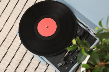 Record player with disk in room, top view