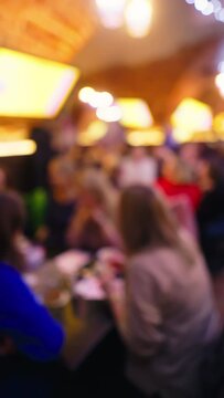 Defocused Vertical Video: Friends Playing Quiz Game in Pub
