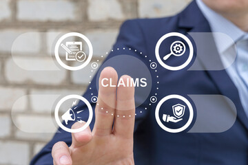 Business man working on virtual touch screen presses word: CLAIMS. Claims Management Business...