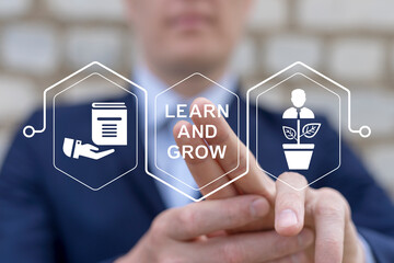 Learn and grow business finance education concept. Man using virtual touch screen presses...