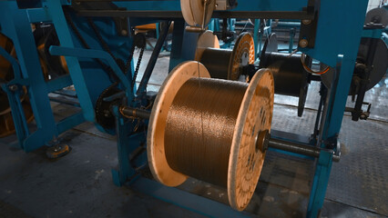 Industrial Machine for winding copper wire on coils. Creative. Automated production of...