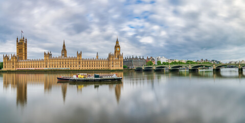 Big Ben and Westminster parliament with reflections in river Thames. London. Great Britain