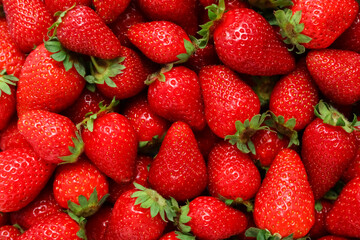 Texture of sweet fresh strawberries as background, closeup