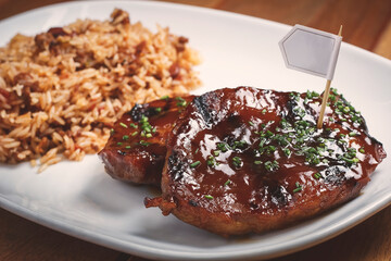 BBQ pork loin accompanied by tasty smoked rice.