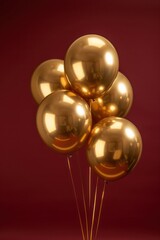 golden shinny hanging balloons isolated on a dark red background