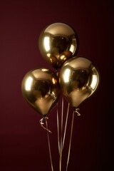 golden shinny hanging balloons isolated on a dark red background