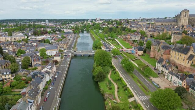 Pont Yssoir bridge on Sarthe River with Saint Julien Cathedral and Gallo-Roman enclosure walls, Le Mans city, France. Aerial forward