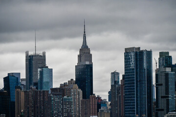 Breathtaking panorama of New York's skyline at sunset, showcasing iconic skyscrapers under a vibrant sky.