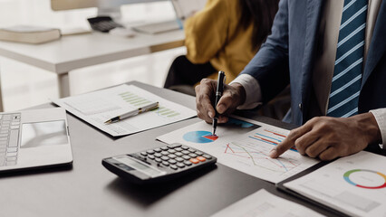 Auditor and accounting team working in the office Analyze financial data and accounting records with a calculator. Accounting companies provide near-term financial and tax planning services.