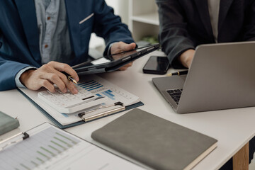 Auditor and accounting team working in the office Analyze financial data and accounting records with a calculator. Accounting companies provide near-term financial and tax planning services.