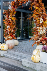 Exterior Beautiful cozy atmospheric halloween pumpkins decorated on porch. Autumn leaves and fall...