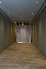 The living room's empty space can be used for organizing activities with partitions and live spotlights.