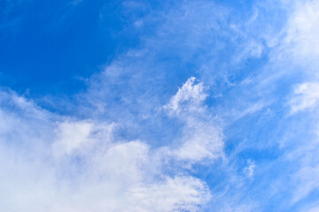 beautiful blue sky and white fluffy group of clouds with sunrise in the morning, natural background