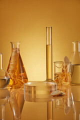 Yellow color tone photo with ginseng experiment theme, glassware in lab containing yellow liquid...
