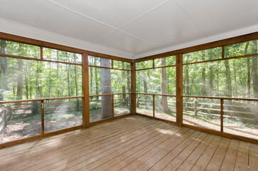 Enclosed Screened in Wooden Deck in A Natural Setting with Wood Floors