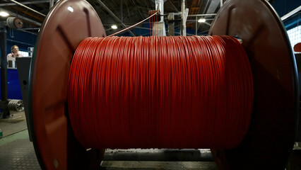 Cable production workshop and large coil. Creative. Modern cable manufacturing factory details.