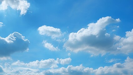 A vibrant blue sky filled with an array of fluffy white clouds. The clouds vary in size and shape, scattered across the sky, creating a picturesque and tranquil scene. Wonder of nature background.
