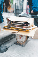 Pile of used box cardboard papers placed on scales for sale to the vendor, buy unused item