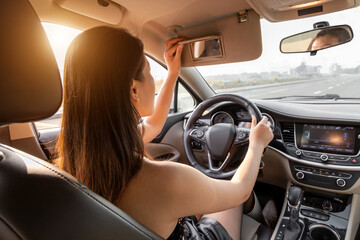 A female perspective on the driver's cabin of a car