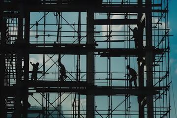 A group of construction workers are working on a building