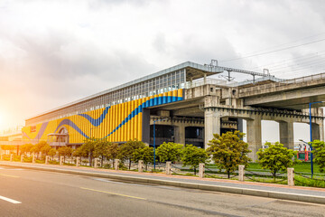 High speed intercity trains departing under the sunshine