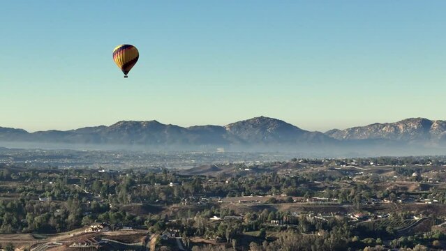 Temecula Hot Air Balloon Drone Parallax Shot Moving To The Right Minimal cloud cover over wineries