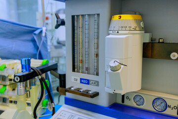 In an operating room, doctor performed surgery using surgical equipment, anesthesia machine, monitoring of patient
