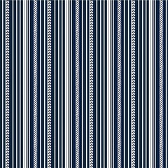 seamless pattern with striped fabric pattern with varying widths of navy blue
