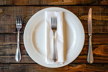 Dining arrangement. Plate, knife, fork, and napkin
