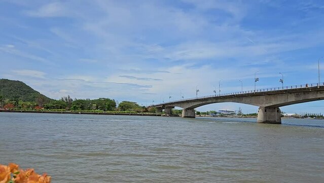 4k pan tilt mountain and vehicle moving on To Chau bridge, Ha Tien town, Kien Giang province Vietnam.