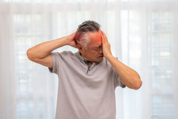 Sick unhappy senior elderly man touching head serious depressed feeling headache thinking of...