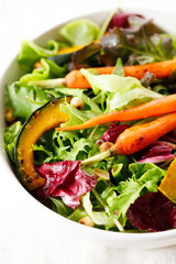 Green salad with grilled carrot, roasted pumpkin and green leaf.