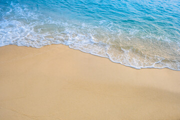 Nature of the beach and sea Summer with sunshine, sandy beaches, clear blue waters sparkling against the blue sky. On an island with good ecology and environment Background for summer vacation
