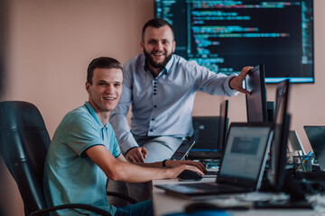 Programmers engrossed in deep collaboration, diligently working together to solve complex problems...