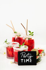 Watermelon drink in glasses with slices of watermelon.