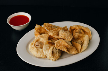 Deep Fried Wontons with sweet and sour sauce