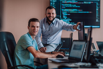 Programmers engrossed in deep collaboration, diligently working together to solve complex problems...