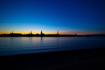 A beautiful Riga cityscape during colorful sunrise. Buildings against colorful sky. Northern Europe...