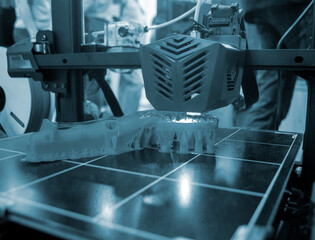 3D printer working close-up. 3D printer prints model from molten plastic close-up. 3D printer...