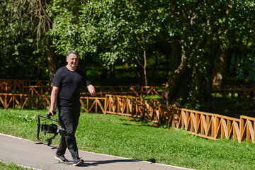 After completing a cinematic venture, a skilled videographer, adorned with camera equipment,...