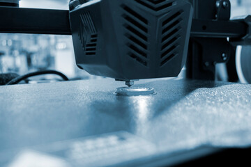 3D printer working close-up. 3D printer prints model from molten plastic close-up. 3D printer...