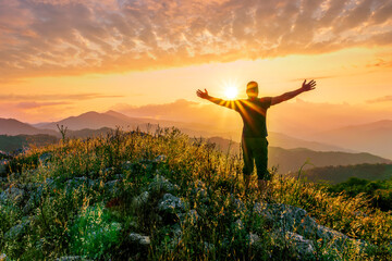 man doing hiking sport in mountains with anazing highland view